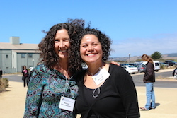 two attendees getting blown by the wind